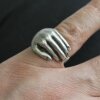 Hand Holding Ring Silver