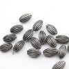 10 Dark Antique Silver Corrugated Oval Beads