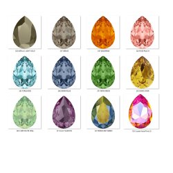 Elegant earrings with sparkling pear-shaped Swarovski crystals in an antique brass frame. Perfect for special occasions and as a stylish accessory for everyday wear.