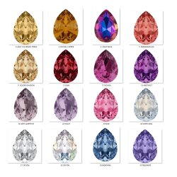 Elegant earrings with sparkling pear-shaped Swarovski crystals in an antique brass frame. Perfect for special occasions and as a stylish accessory for everyday wear.