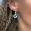Elegant earrings with sparkling pear-shaped Swarovski crystals in an antique brass frame. Perfect for special occasions and as a stylish accessory for everyday wear.