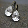 Elegant earrings with sparkling pear-shaped Swarovski crystals in an antique brass frame. Perfect for special occasions and as a stylish accessory for everyday wear.
