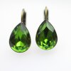 Elegant earrings with sparkling pear-shaped Swarovski crystals in an antique brass frame. Perfect for special occasions and as a stylish accessory for everyday wear.
