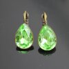 Elegant earrings with sparkling pear-shaped Swarovski crystals in an antique brass frame. Perfect for special occasions and as a stylish accessory for everyday wear.