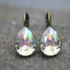 Elegant earrings with sparkling pear-shaped Swarovski crystals in an antique brass frame. Perfect for special occasions and as a stylish accessory for everyday wear.