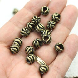 10 floral Beads, antique brass
