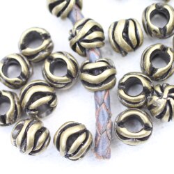 10 floral Beads, antique brass