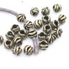 10 floral Beads, antique brass