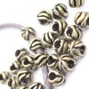 10 floral Beads, antique brass