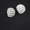 asymmetric oval, hammered stud earrings