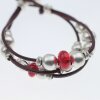 Ethno style Bracelet with ruby red beads and metal elements