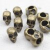 10 Totenkopf Perlen, altmessing