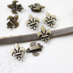 10 Fleur De Lys Schiebeperlen, altmessing