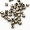 20 Flower Beads, antique brass