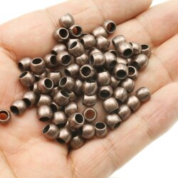 50 Metal Beads 7x5 mm (Ø 4 mm), antique copper